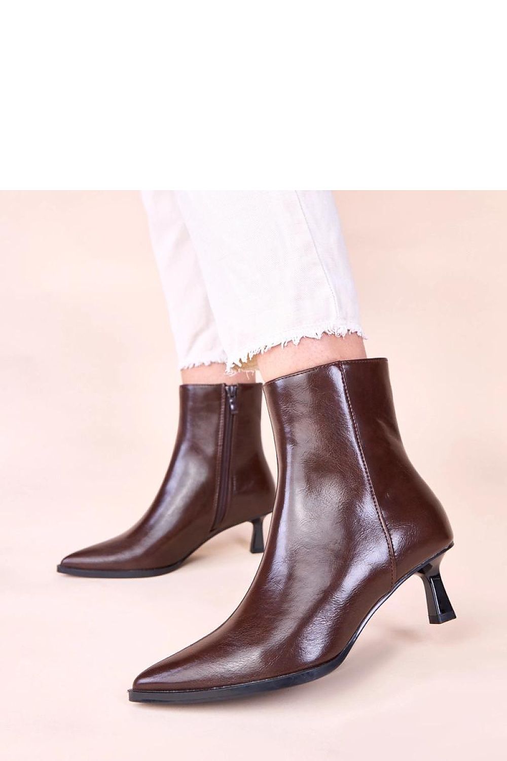 Close-up of the Mordi brown stiletto ankle boots by Gemre, highlighting the high-quality artificial leather and craftsmanship for enduring elegance.
