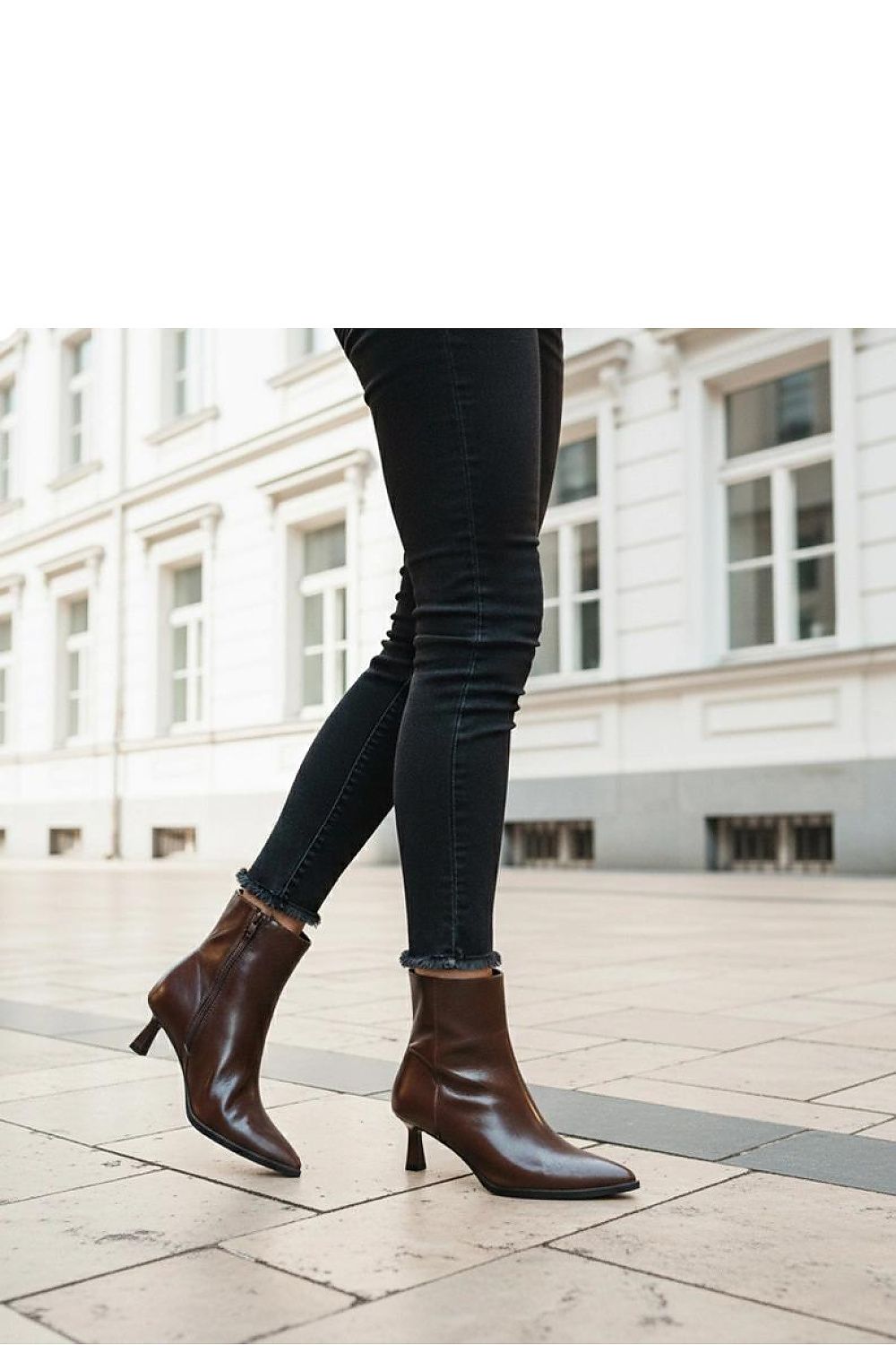 Model wearing Gemre's brown duck-style stiletto ankle boots Mordi, perfectly styled for a chic look that transitions from casual to formal.