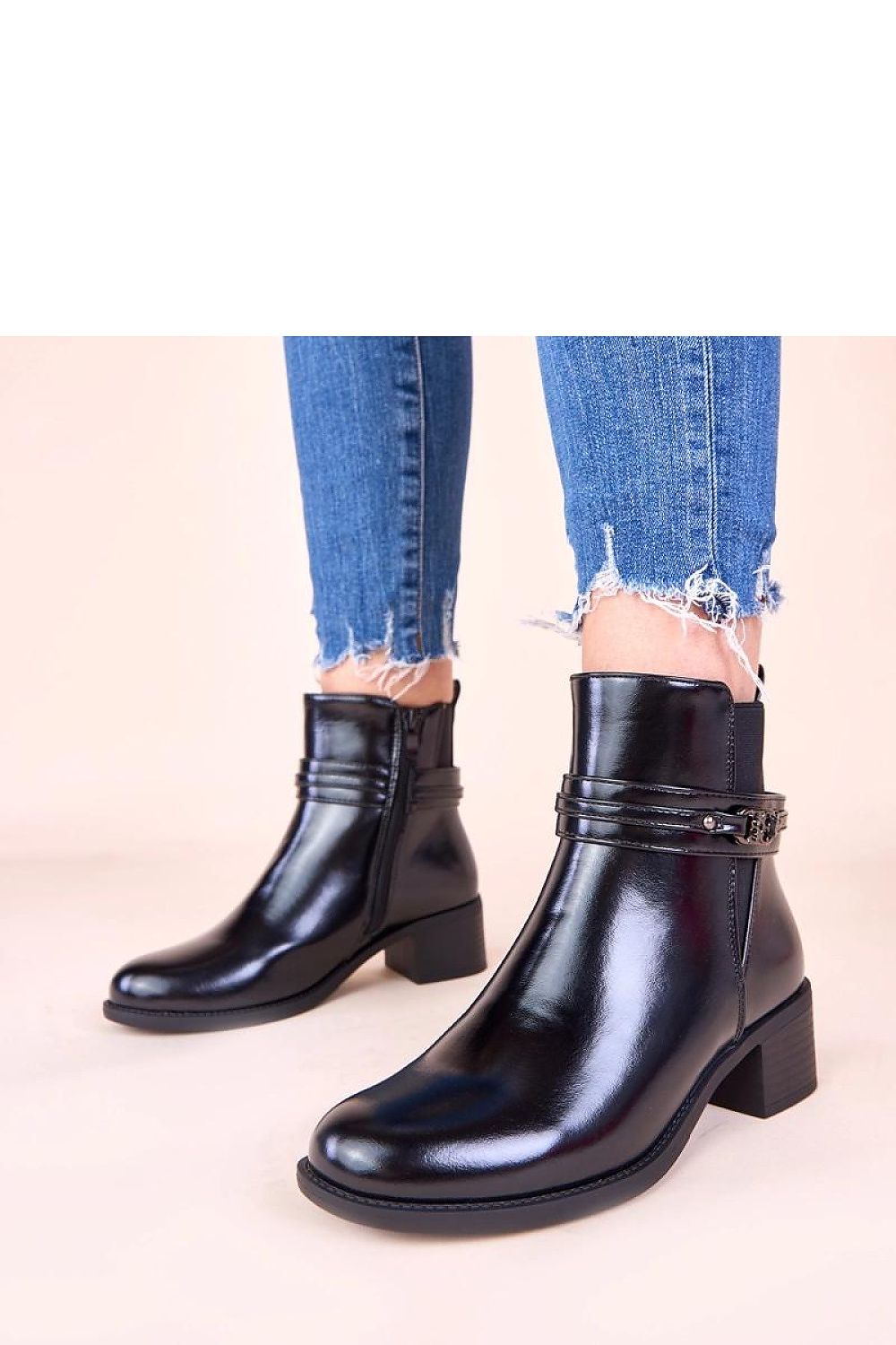 Elegant black block heel ankle boots with decorative strap by Solea, showcasing a modern design perfect for stylish women.