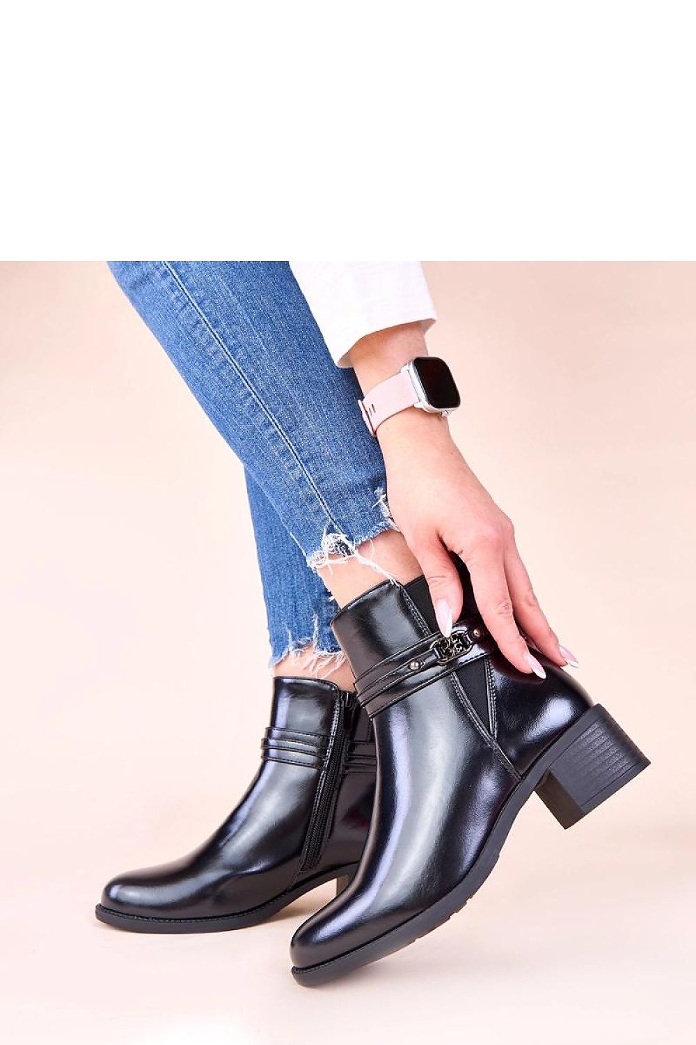 Stylish black block heel ankle boots with a decorative strap from Solea, designed for comfort and sophistication in every step.