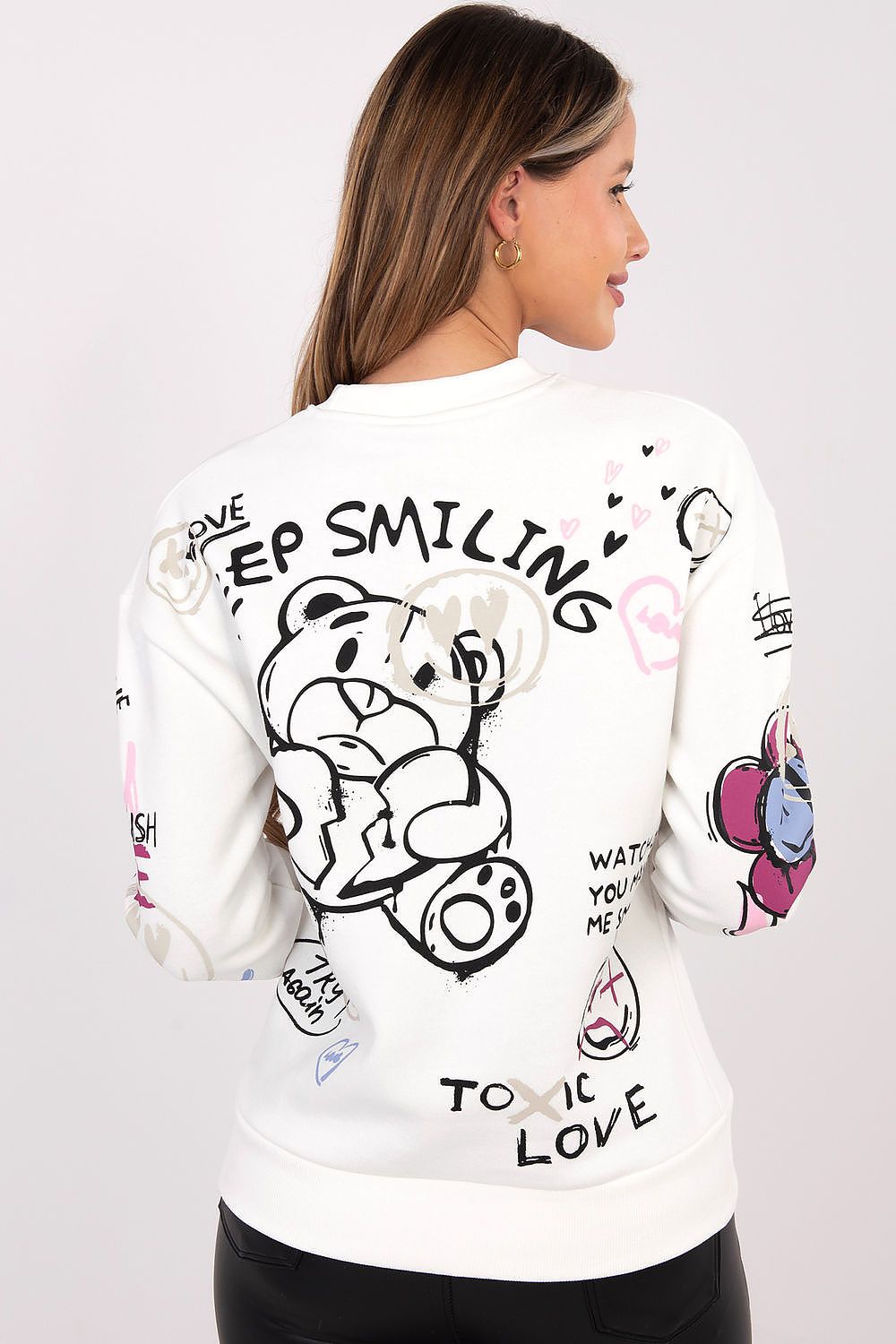 Elegant model wearing Sublevel stylish women's printed sweatshirt, capturing the timeless sportswear look with a chic round neckline and long sleeves.