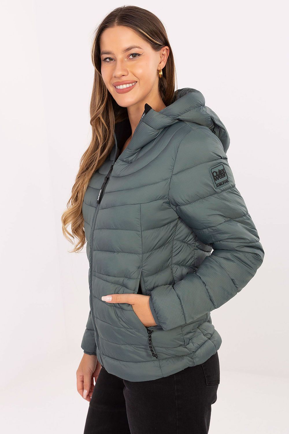 Close-up of Sublevel's lightweight and stylish women's quilted transitional jacket, highlighting the high-quality polyamide fabric.