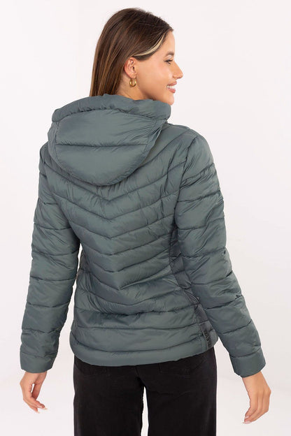 Practical design features of the Sublevel women's quilted jacket, including zippered pockets and warm polyester filling.