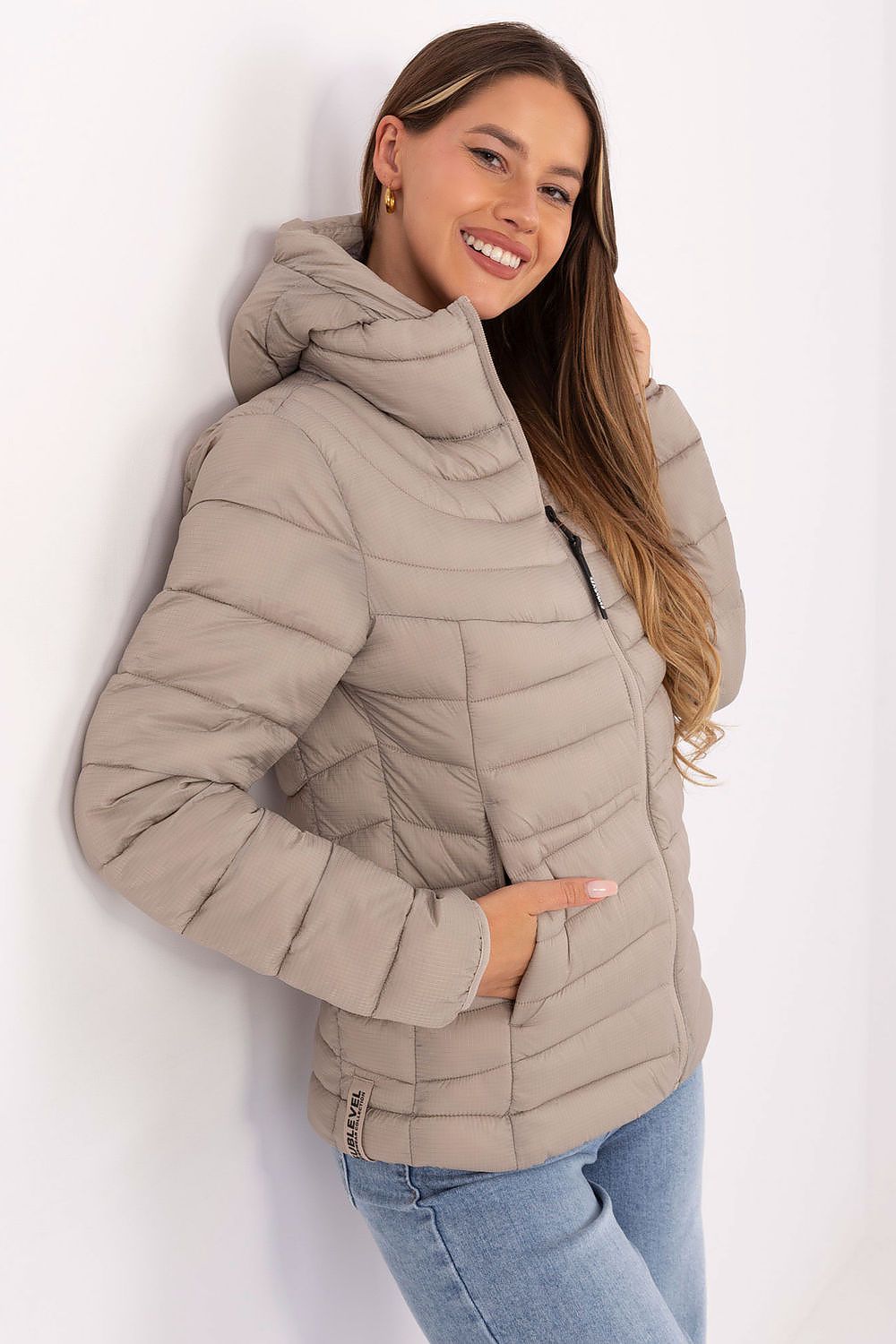 Practical hood on the Sublevel women's quilted jacket, ideal for protection against wind and light rain, enhancing luxury style.