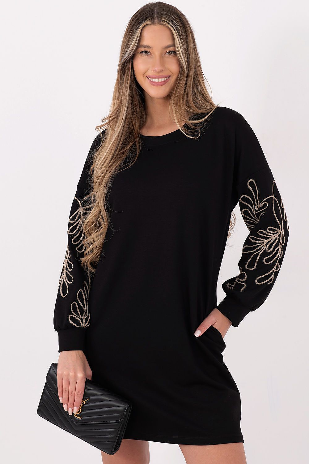 Stylishly designed casual dress by Rue Paris, enhancing feminine silhouettes with its embroidered sleeve detail and versatile design.