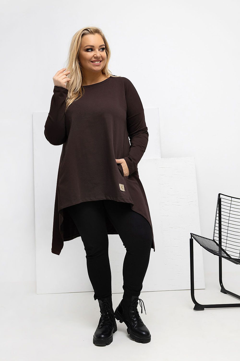 Luxury Plus Size Asymmetrical Tunic Dress by Relevance styled with leggings, capturing the modern and comfortable essence of the dress.