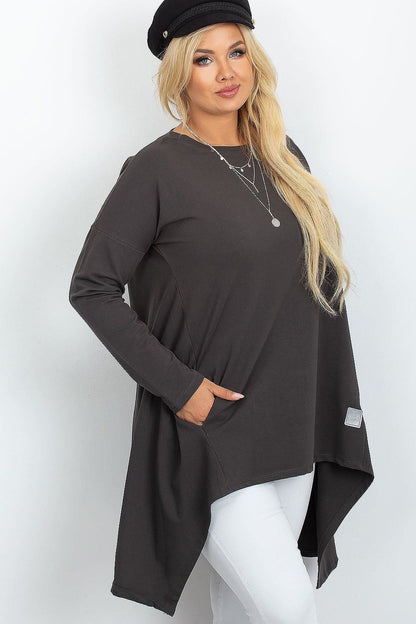 Elegant plus size tunic dress with pockets from Relevance, featuring a soft drape and asymmetrical cut that enhances a sophisticated silhouette.