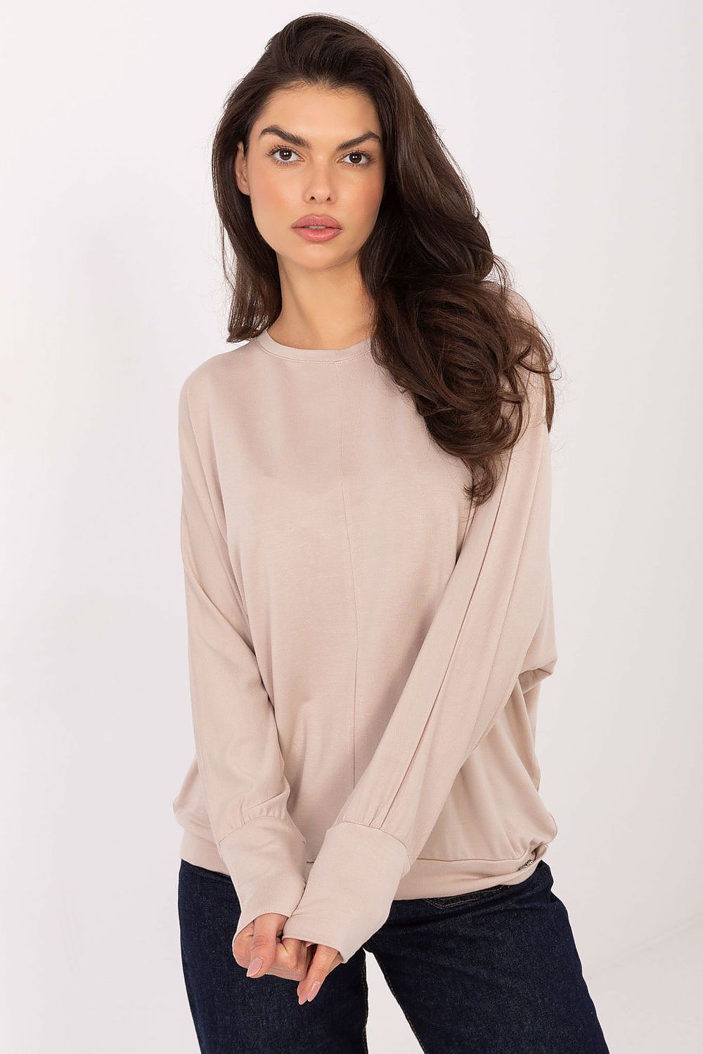 Back view of Relevance luxury blouse, highlighting its comfortable fit and modern patch detail on a minimalist design.