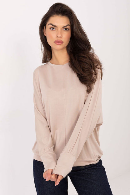 Back view of Relevance luxury blouse, highlighting its comfortable fit and modern patch detail on a minimalist design.