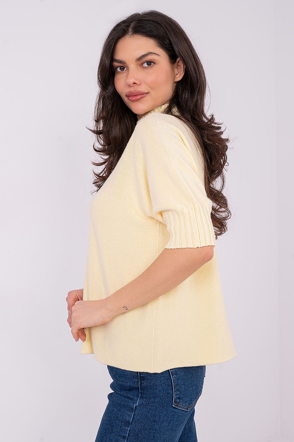 Close-up of luxurious soft touch Women's Short Sleeve Sweater by Italy Moda, featuring delicate knit texture and sophisticated low turtleneck.