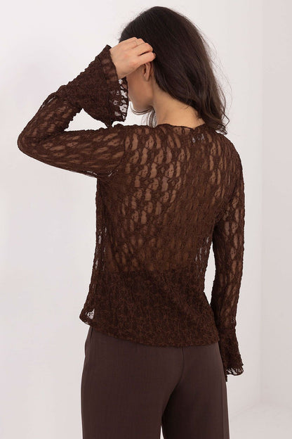Elegant lace blouse by Italy Moda with ruffled bell sleeves, designed for formal occasions, showcasing refined luxury and femininity.