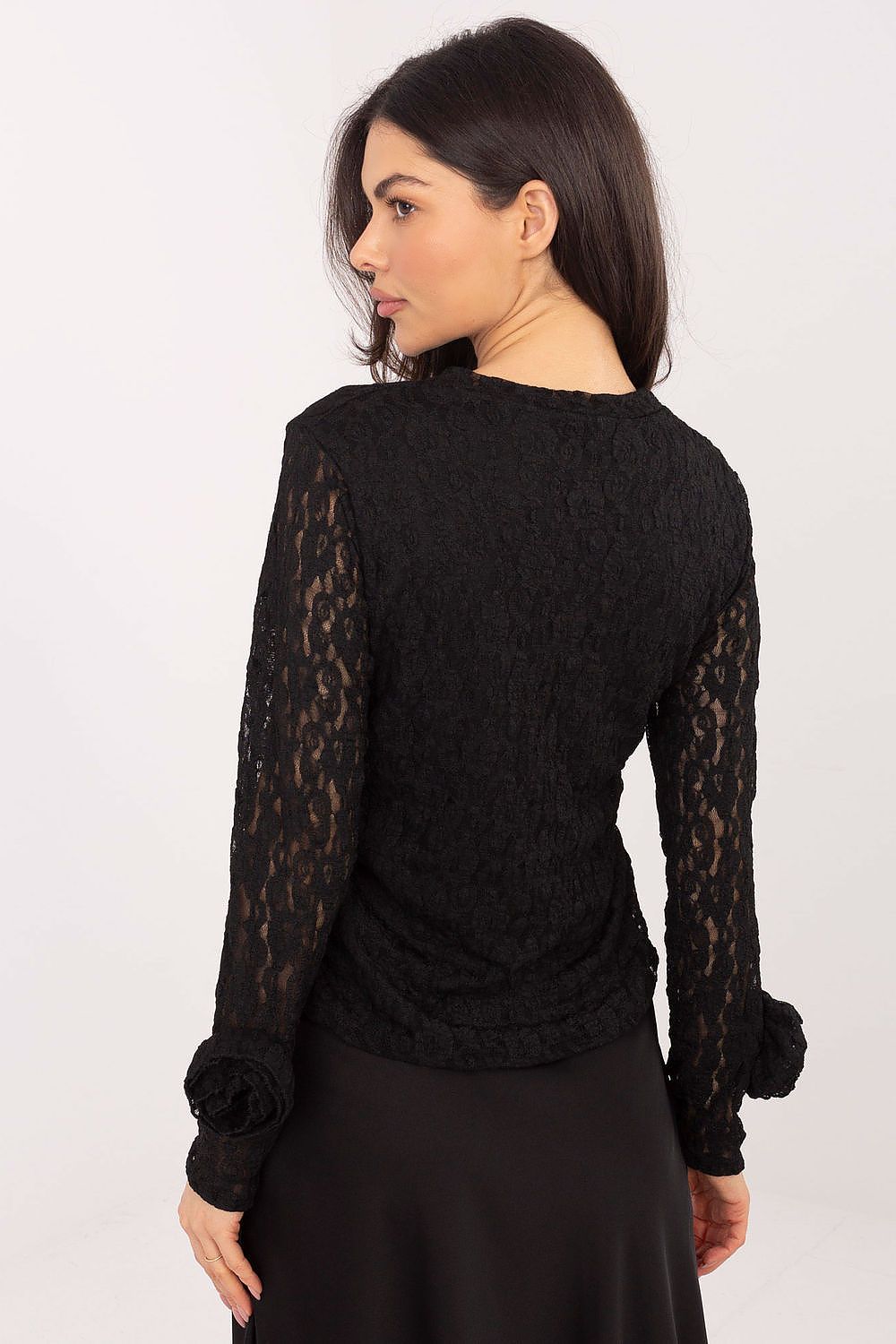 Model wearing the Italy Moda elegant lace blouse, demonstrating its flattering silhouette and comfortable lining, perfect for formal occasions.