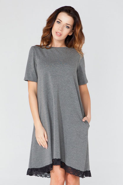 Tessita Women's Cotton Blend Trapeze Daydress in a serene outdoor setting, highlighting the dress's elegance and perfect fit for day-to-night styling.
