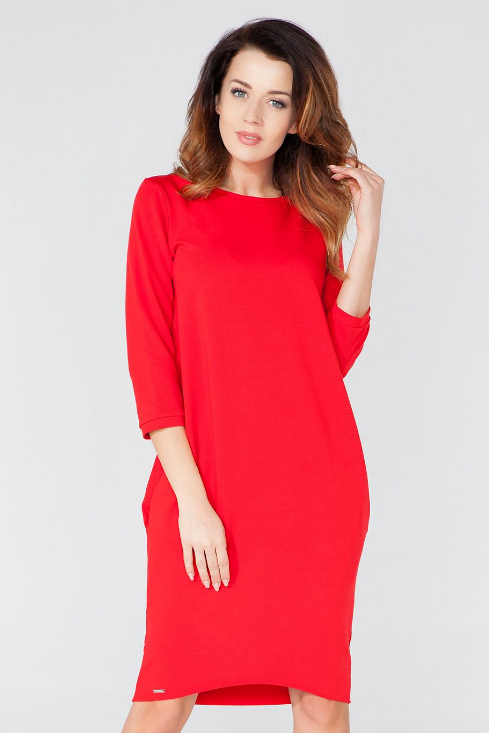 Elegant knitted daydress by Tessita, featuring pockets, 3/4 sleeves, and tuba cut design.
