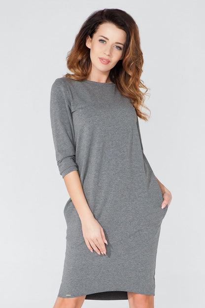 Tessita Elegant Knitted Daydress with Pockets, showcasing a luxurious tuba cut and 3/4 sleeves for a sophisticated look.