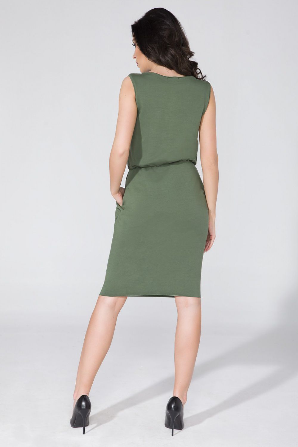 Luxury Tessita Knitwear Daydress featuring concealed pockets and waist definition in elegant fabric, perfect for a sophisticated look.