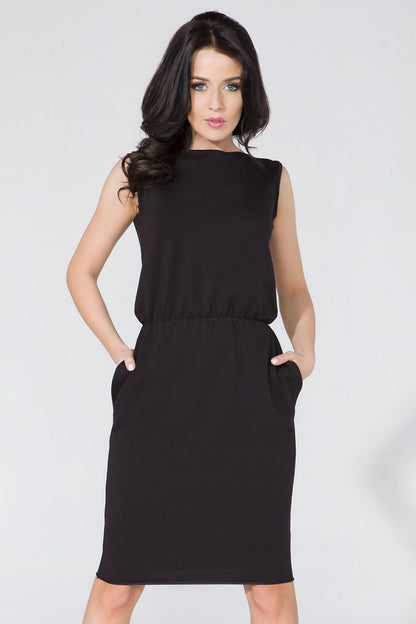 Exquisite Tessita Knitwear Daydress highlighting waist definition and unique pocket design, ideal for timeless elegance.