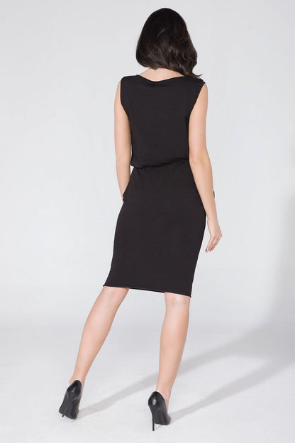 Tessita luxurious knitwear daydress featuring concealed pockets and waist definition, displayed elegantly in a flattering fit.
