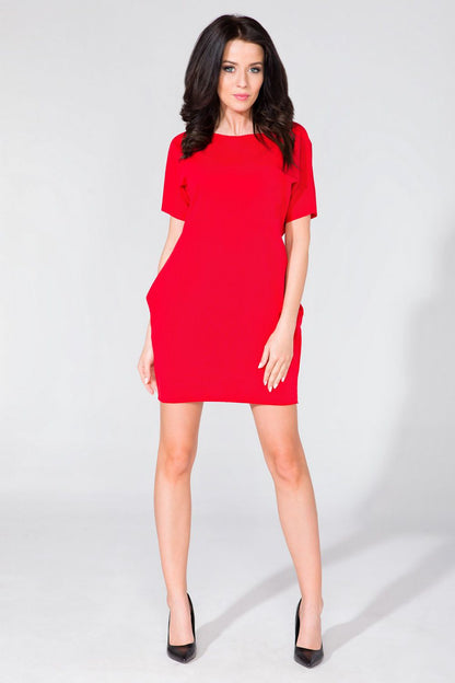 Close-up of the raw neckline detail on the Tessita Daydress, showcasing its sophisticated yet casual elegance.