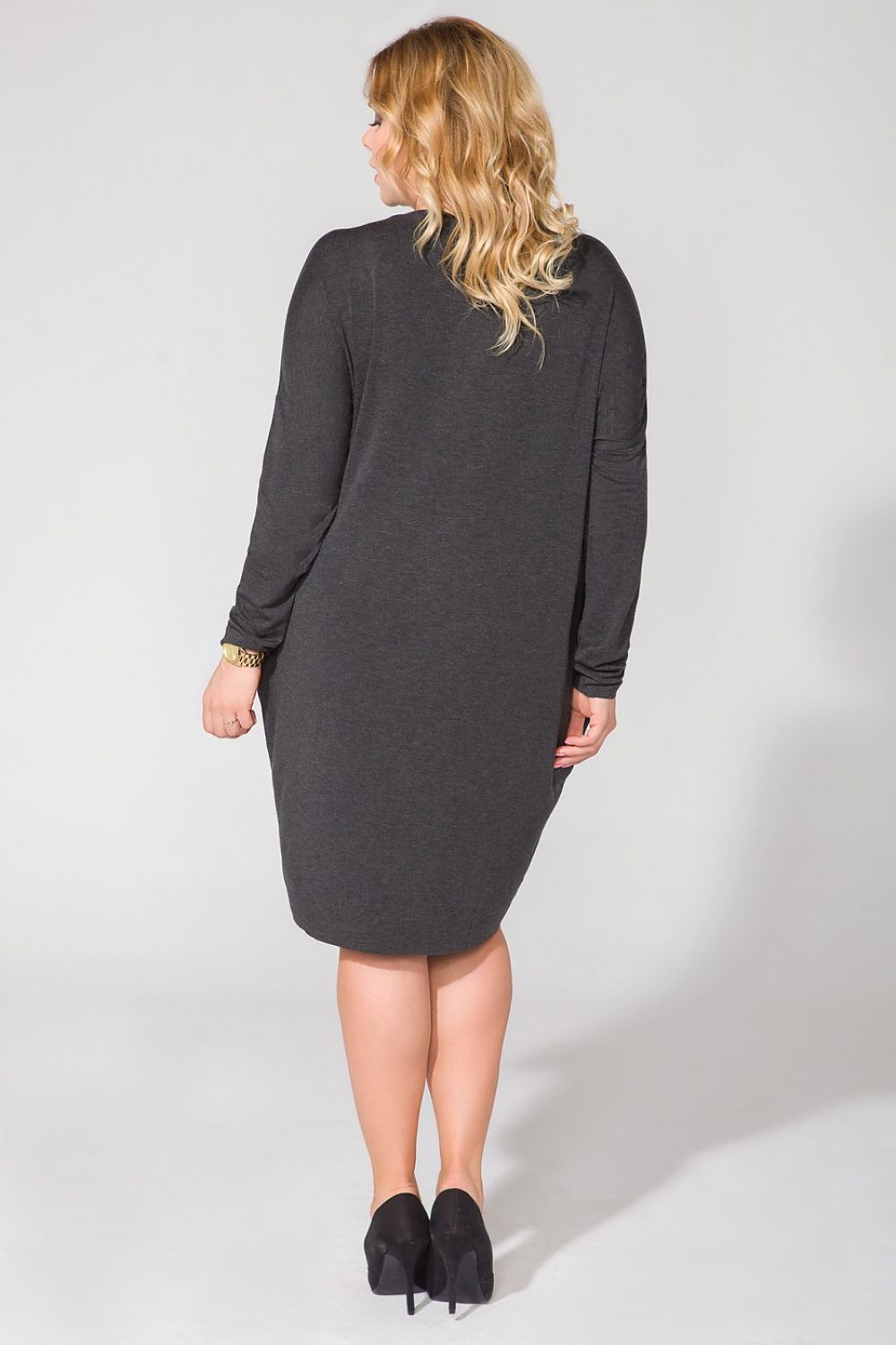 Tessita Wide Cut Knit Dress elegantly displaying long sleeves and a relaxed fit, perfect for sizes 44-56 with a chic raw hem detail.