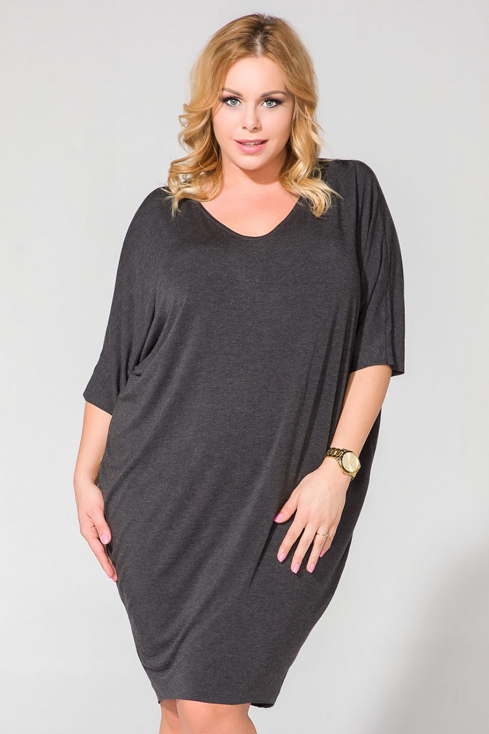 Tessita Wide Cut Knit Dress with V-Shaped Neckline and Drape Finish - Luxurious Style showcasing elegant design in a chic setting.