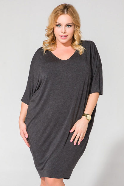 Tessita Wide Cut Knit Dress with V-Shaped Neckline and Drape Finish - Luxurious Style showcasing elegant design in a chic setting.