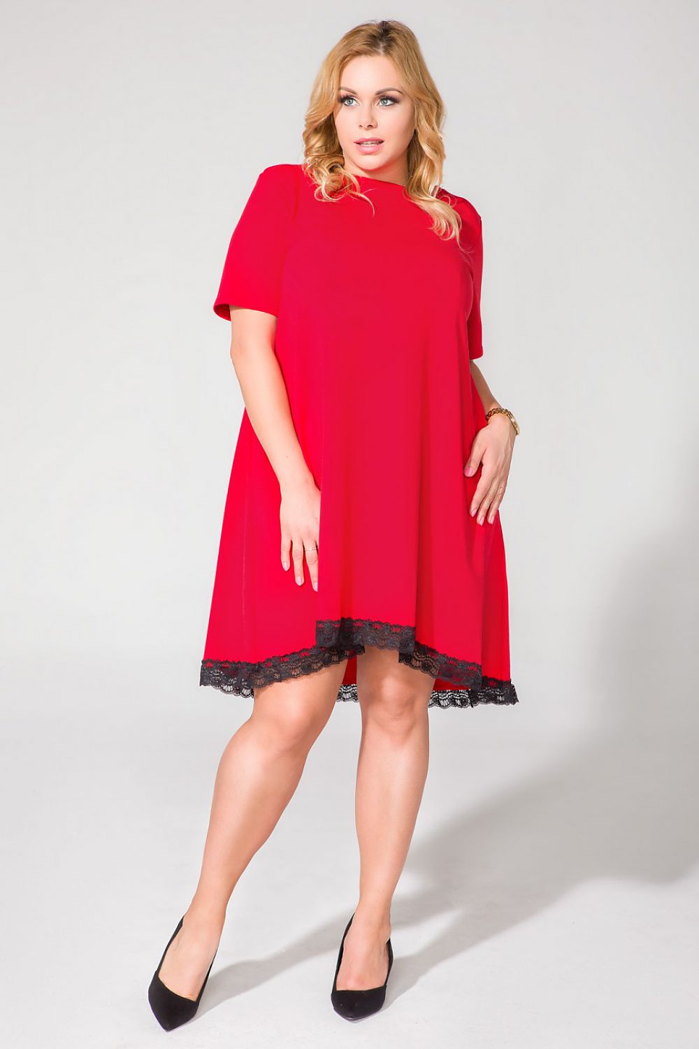 Fashion model wearing Tessita Women's Cotton Blend Trapeze Daydress with Lace Trim and Pockets, demonstrating its graceful silhouette and luxe fabric.
