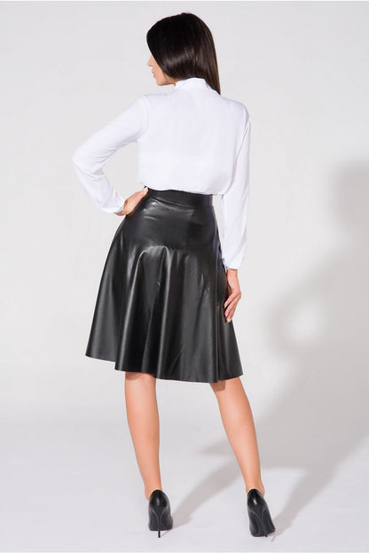 Elegant Tessita Blouse with bow neckline and stand-up collar, elegantly styled in a chic setting by Tessita.