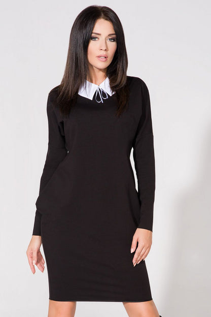 Side view of Chic Evening Dress with Pockets and Raw Edge Detail by Tessita, capturing its wide cut and sophisticated silhouette.