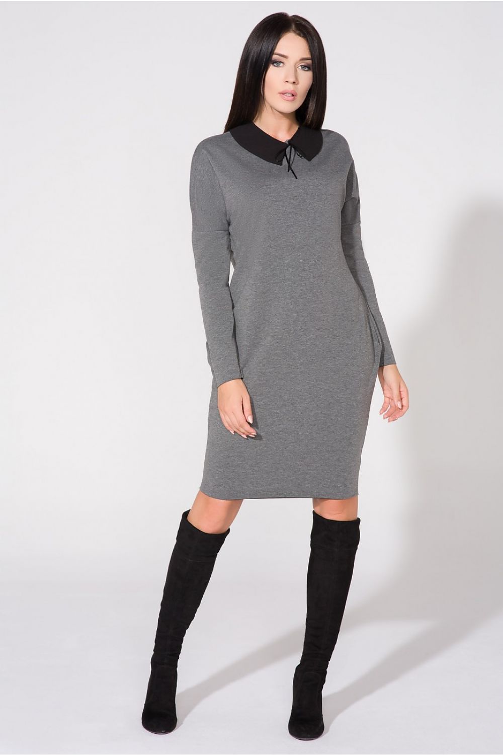 Close-up of the stylish raw edge detailing of the chic evening dress by Tessita, perfect for sophisticated occasions.