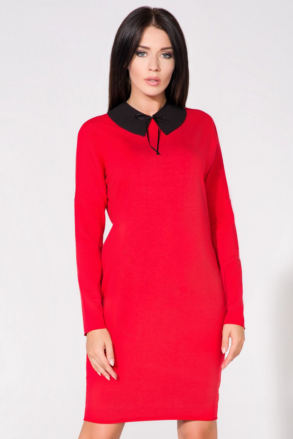 Back view of the chic evening dress with pockets by Tessita, highlighting its elegant silhouette and raw edges.