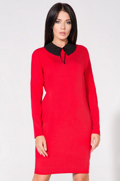 Back view of the chic evening dress with pockets by Tessita, highlighting its elegant silhouette and raw edges.