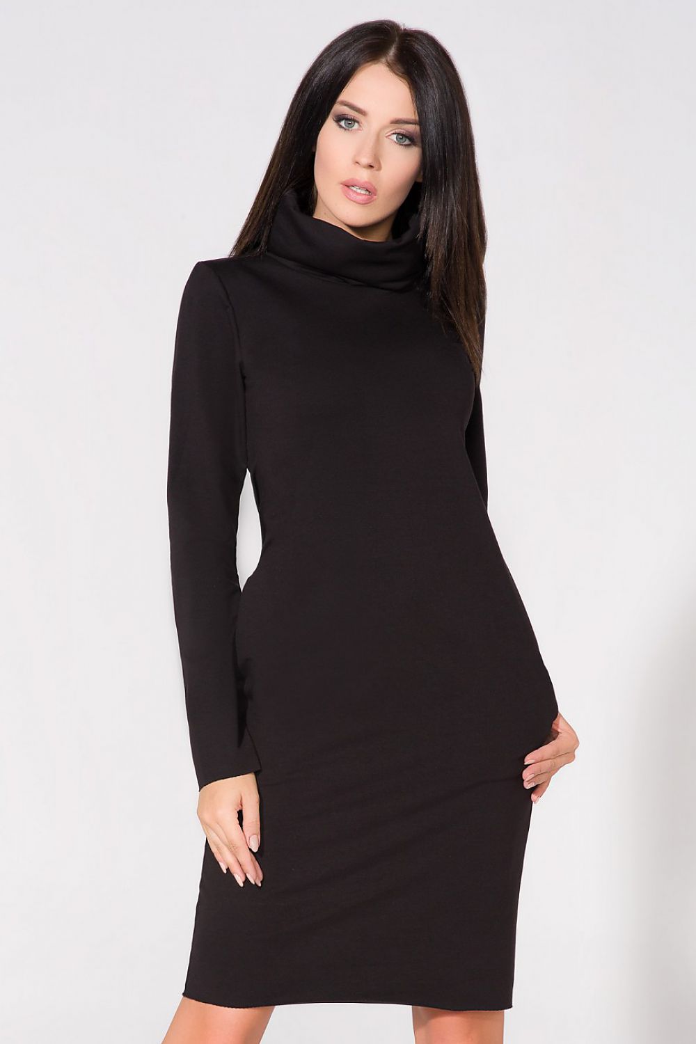 Model wearing the Elegant Knit Dress with Raw Edges and Seam Pockets by Tessita, exemplifying chic style and versatility.