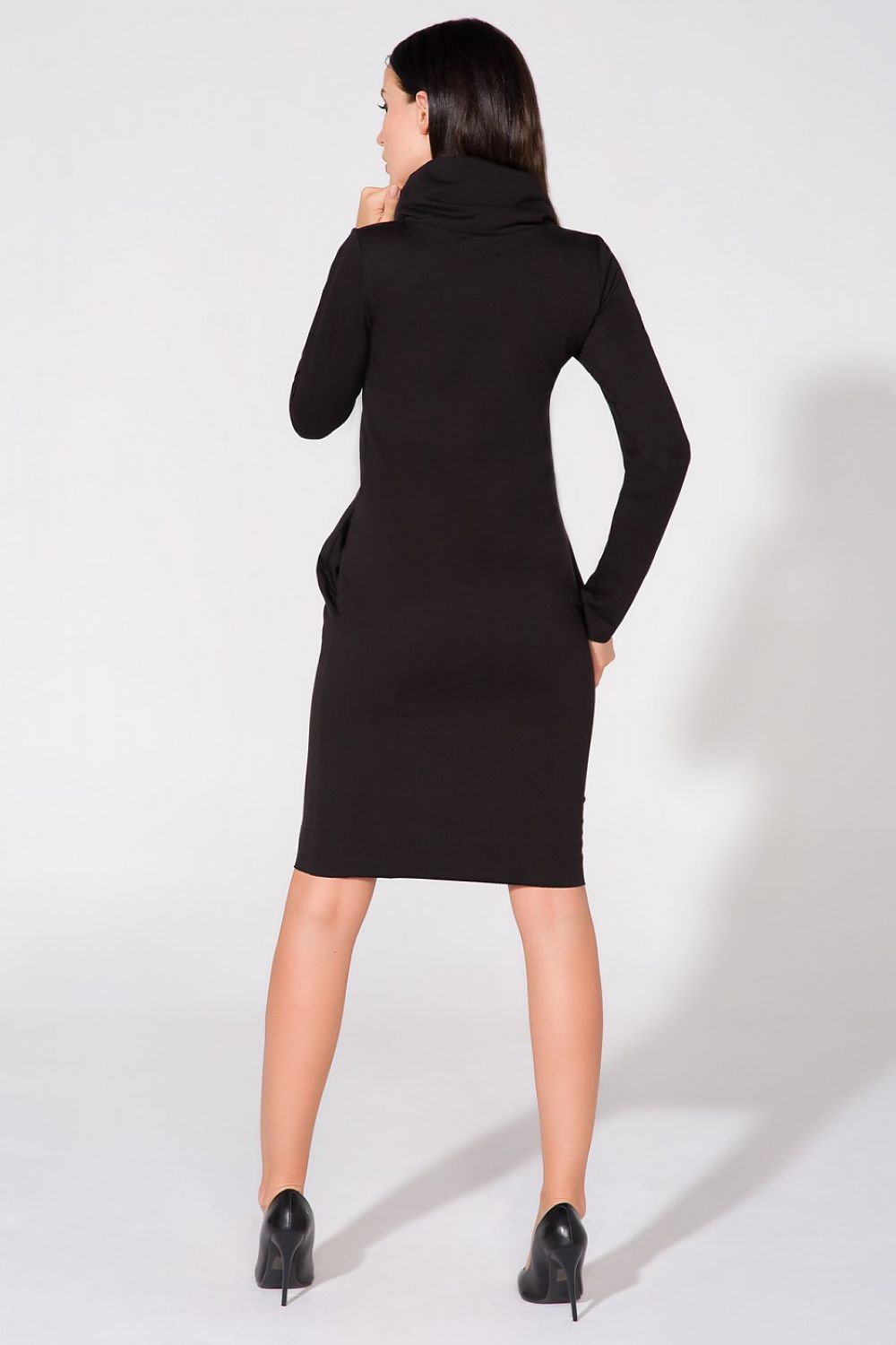 Elegant Knit Dress by Tessita in various sizes, featuring raw edges and seam pockets for an exquisite and modern silhouette.