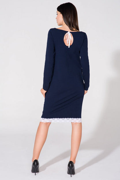 Side view of the Luxurious Tessita Daydress by Tessita, highlighting the seamless pockets and raw sleeve finish.