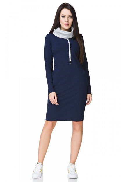 Elegant display of Tessita sporty daydress featuring a chic turtleneck and functional side pockets, highlighting its colourful knitted texture and sophisticated style.