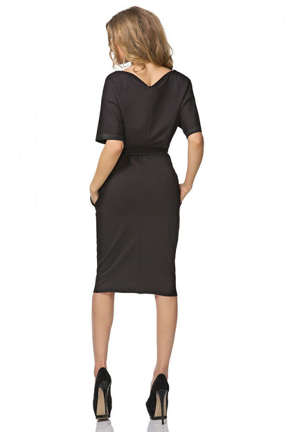 Stylish Tessita Kimono Dress with Waist Tie, complete with side pockets and elbow-length sleeves for a luxe summer wardrobe.