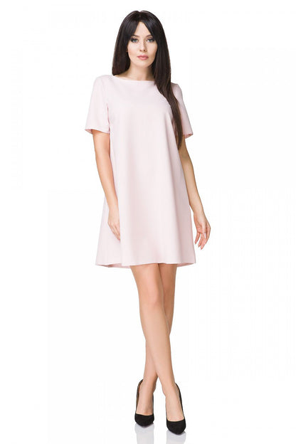 Elegant Tessita Cocktail Dress showcasing the short trapeze design and straight neckline, perfect for summer outings.