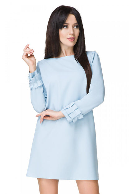 Model showcasing the Elegant Mini Dress with Trapeze Cut, Drape Neckline and Frilled Long Sleeves by Tessita, ideal for garden parties.