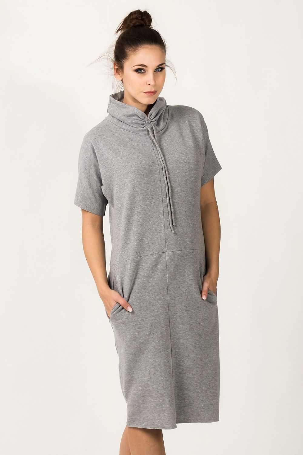 Tessita Luxury Knit Turtleneck Daydress with Pockets, showcasing its elegant loose fit and short sleeves in a stylish and comfortable design.