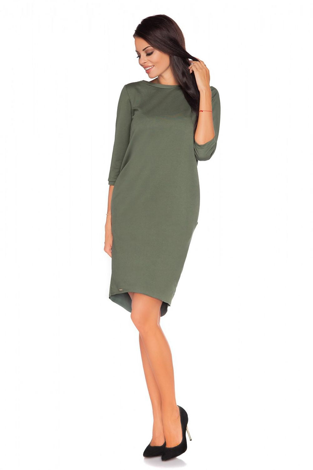 Side view of Luxury Knitwear Daydress by Tessita, highlighting the comfortable pockets and sophisticated fit.