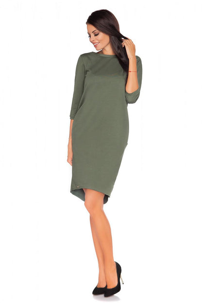 Side view of Luxury Knitwear Daydress by Tessita, highlighting the comfortable pockets and sophisticated fit.