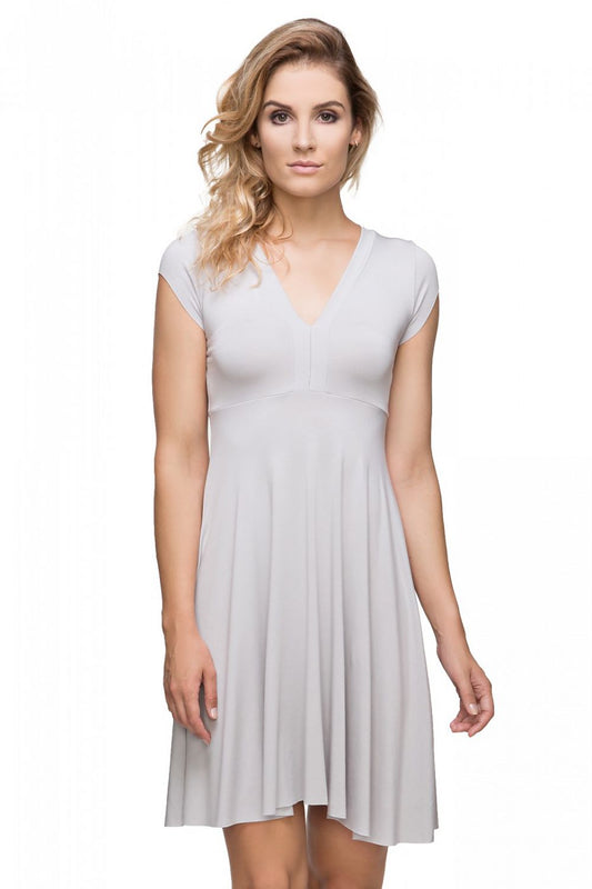 Elegant knitted evening dress by Tessita featuring a deep V neckline and flared hem, perfect for luxurious outings.