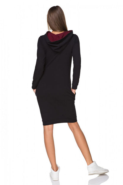 Elegantly designed Tessita sports daydress featuring a stylish hood, contrasting colour details, and functional pockets, crafted for comfort and everyday sophistication.
