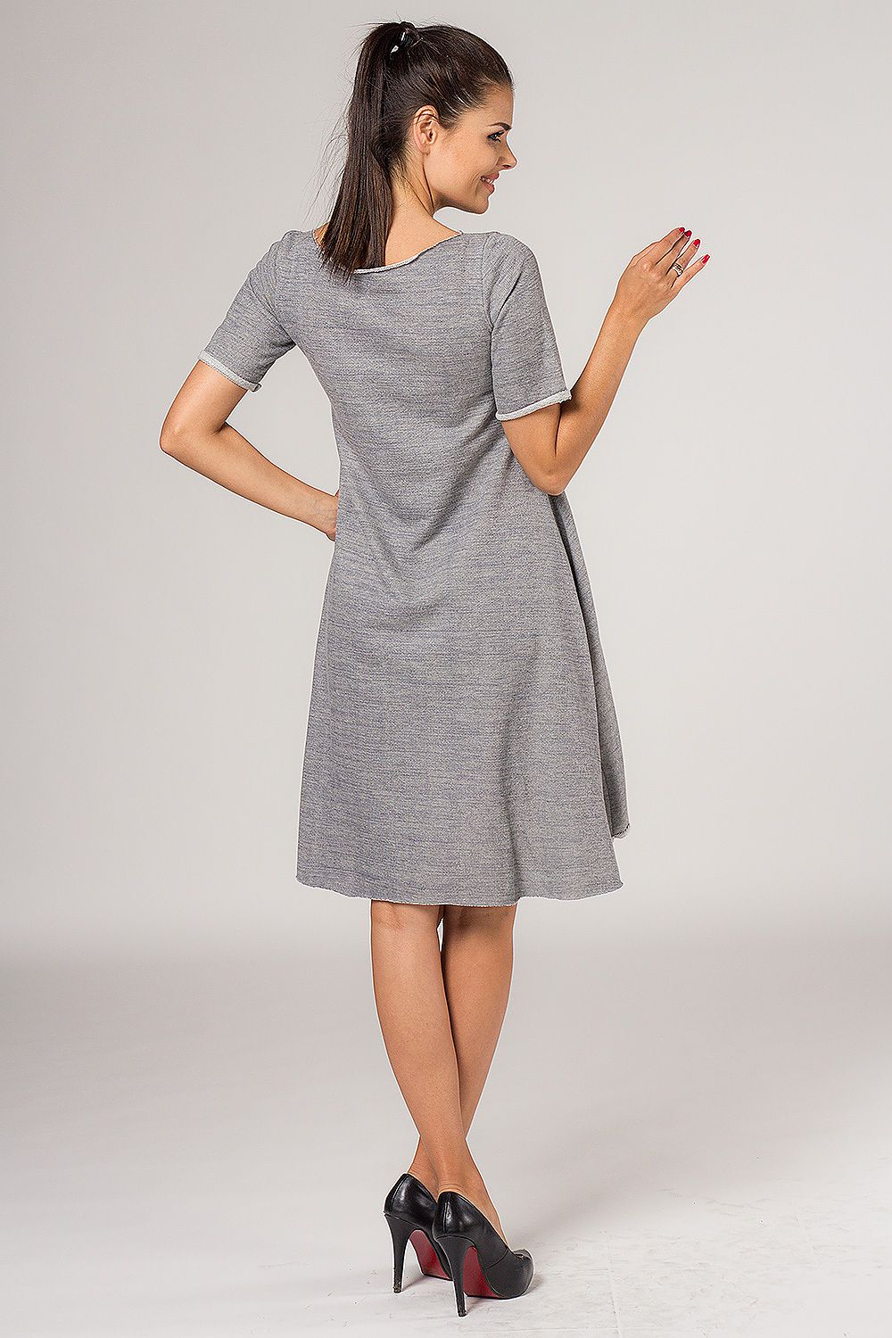 Tessita Grey Quilted Daydress in a sophisticated setting, highlighting its elegant style and flared silhouette.