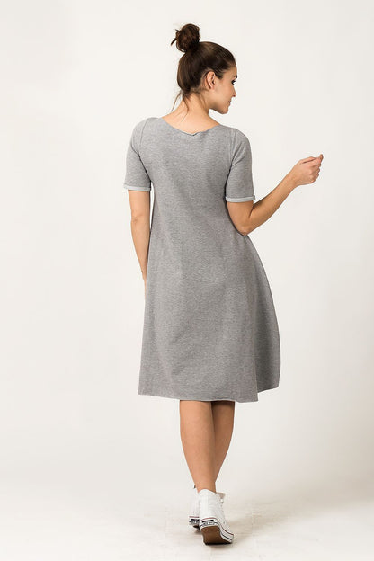 Tessita Grey Quilted Daydress showcasing its exquisite quilted fabric and unique design for stylish everyday wear.