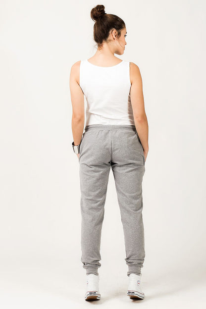 Tessita Luxury Light Grey Tracksuit Trousers with wide ribbed cuffs displayed on a model, epitomizing comfort and style.