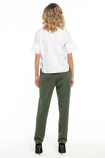 Tessita elegant women's trousers in cotton knit, boasting pockets for practical luxury.