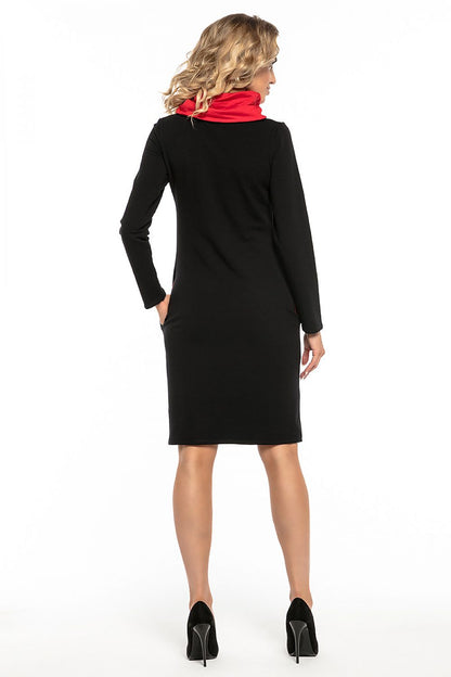Elegant Tessita black cotton knit sports dress featuring a contrasting chimney and pockets for a sophisticated athletic look.