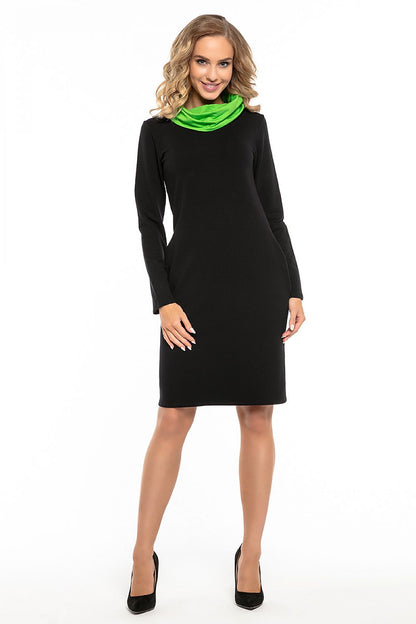 Model wearing the Tessita black cotton knit sports dress, illustrating its flattering silhouette and stylish design suitable for active lifestyles.
